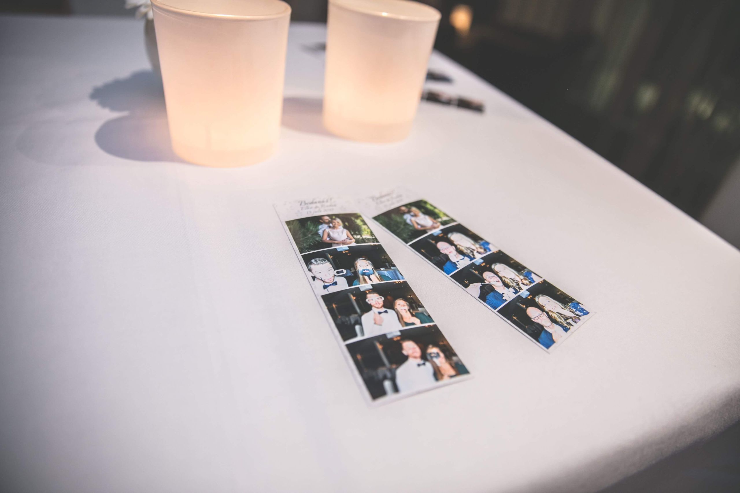 Two printed photo strips on a table
